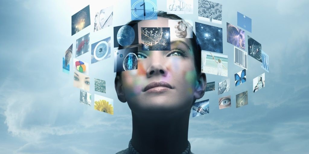 Woman looking up as a halo of floating images and screens surrounds her